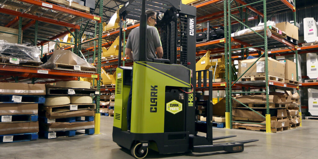 how to operate a stand up reach forklift