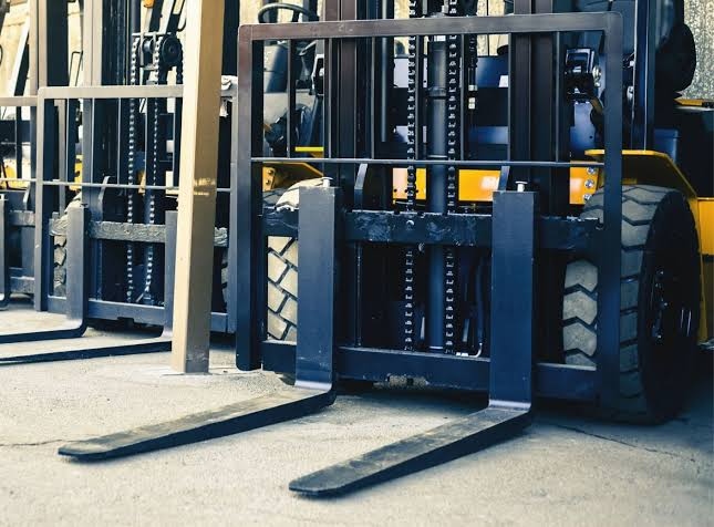 how much space between a forklift mast and door