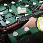 how to raise specific gravity in a forklift battery
